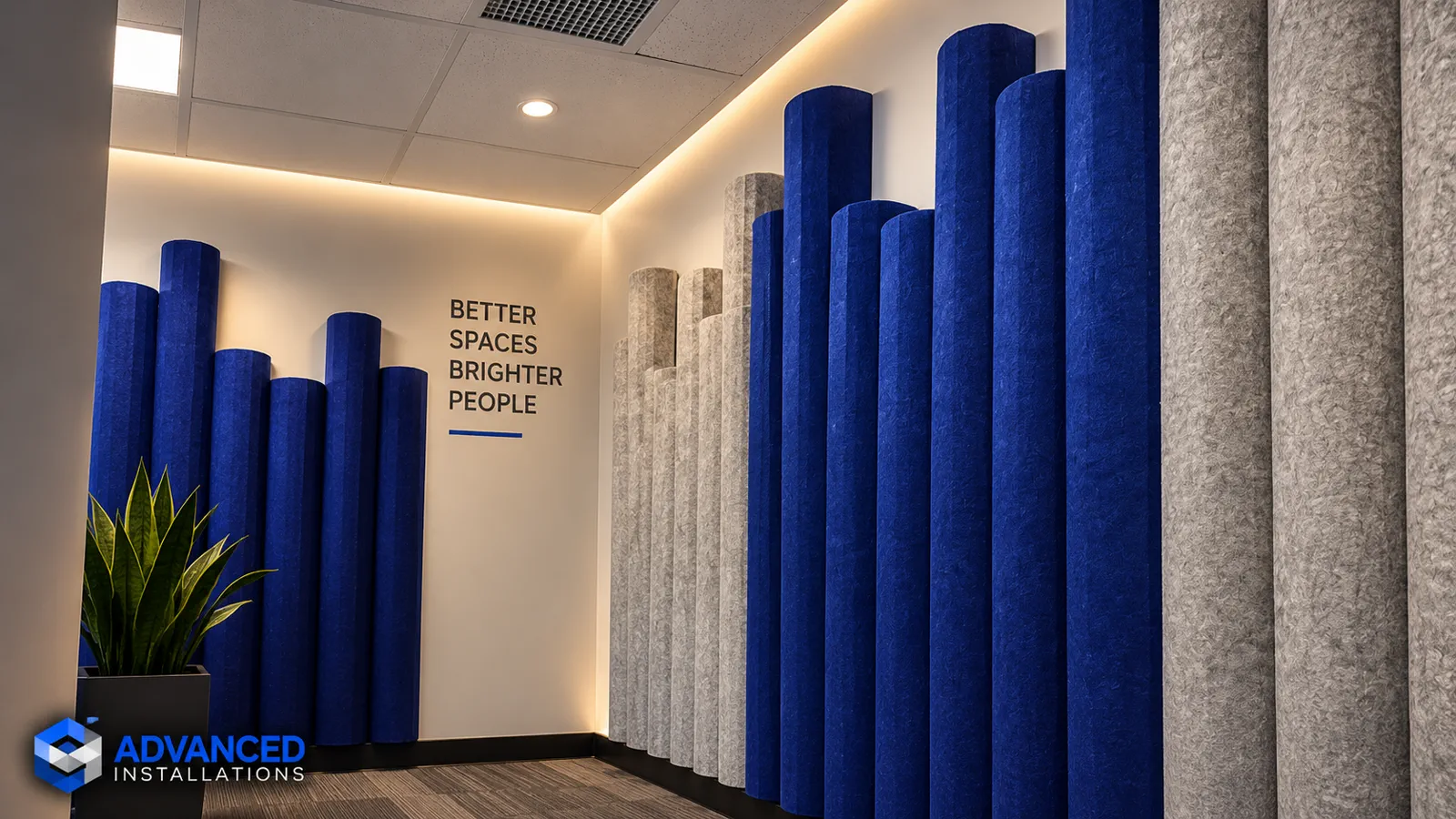 Blue and grey acoustic panels in a bright workplace