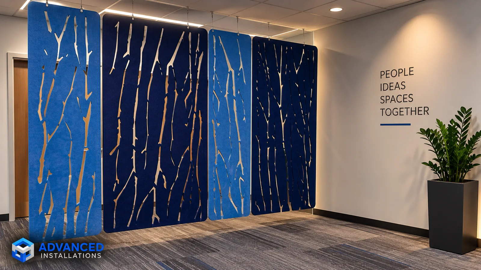 Modern office lobby with blue acoustic screens and collaborative work areas